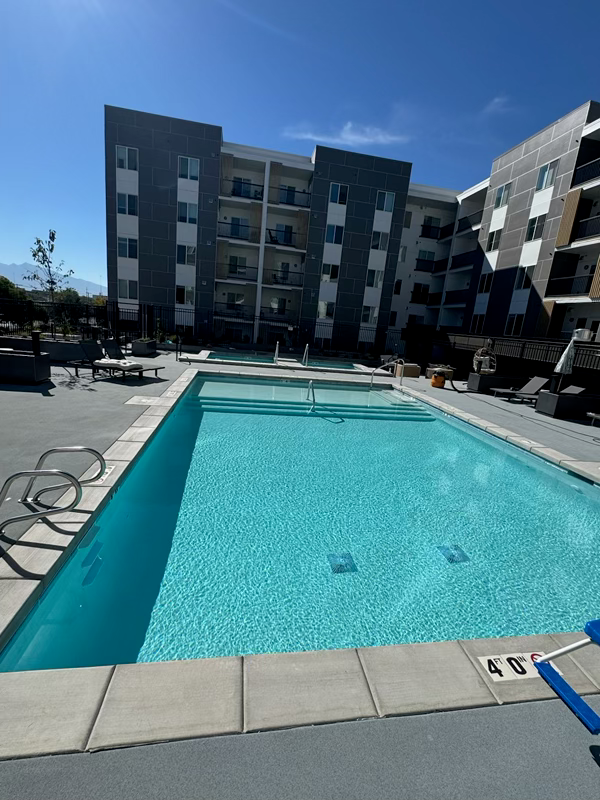 Finished swimming pool and deck at the Millcreek commercial project.